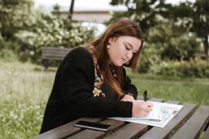 writing lady on desk